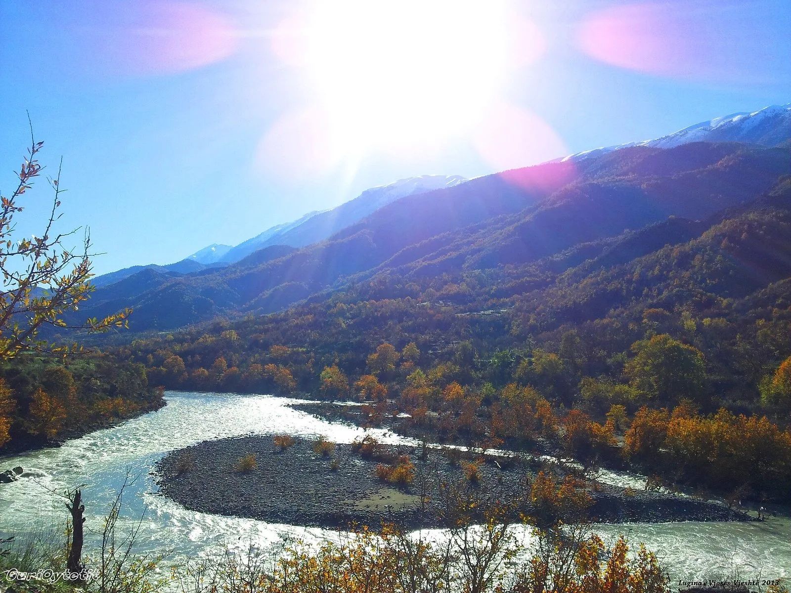 The Vjosa valley in the Përmet district, with mountains in the background