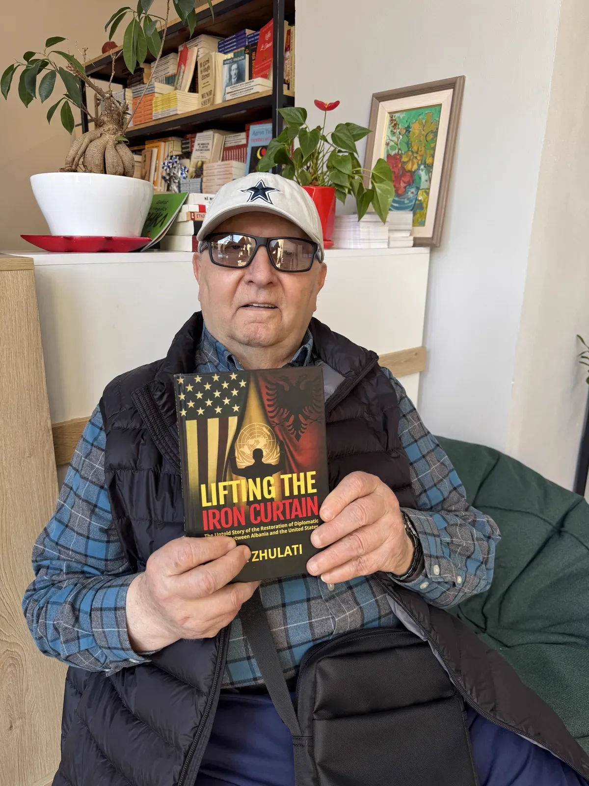 Ilia Zhulati with his book “Lifting the Iron Curtain”